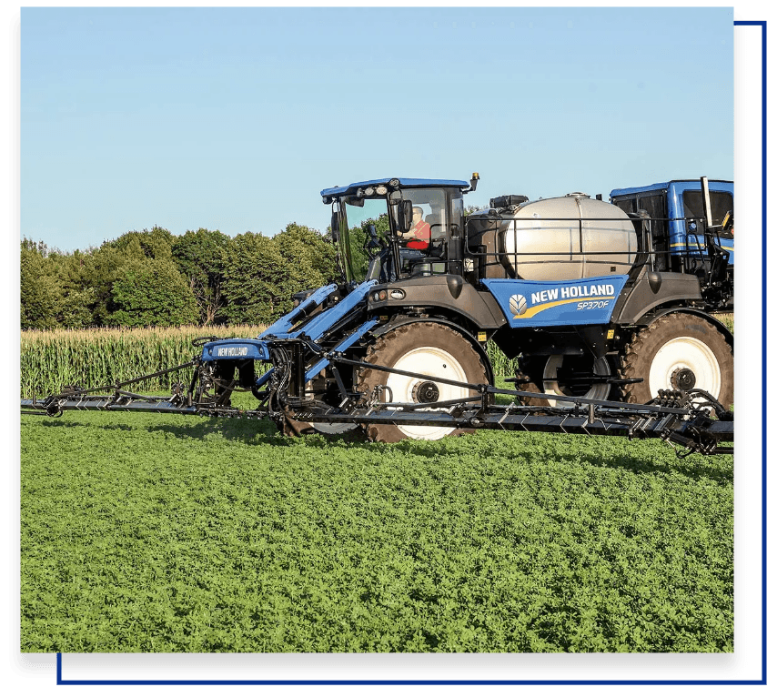 New Holland Guardian™ front boom sprayer in action, delivering precision and efficiency for agricultural applications.
